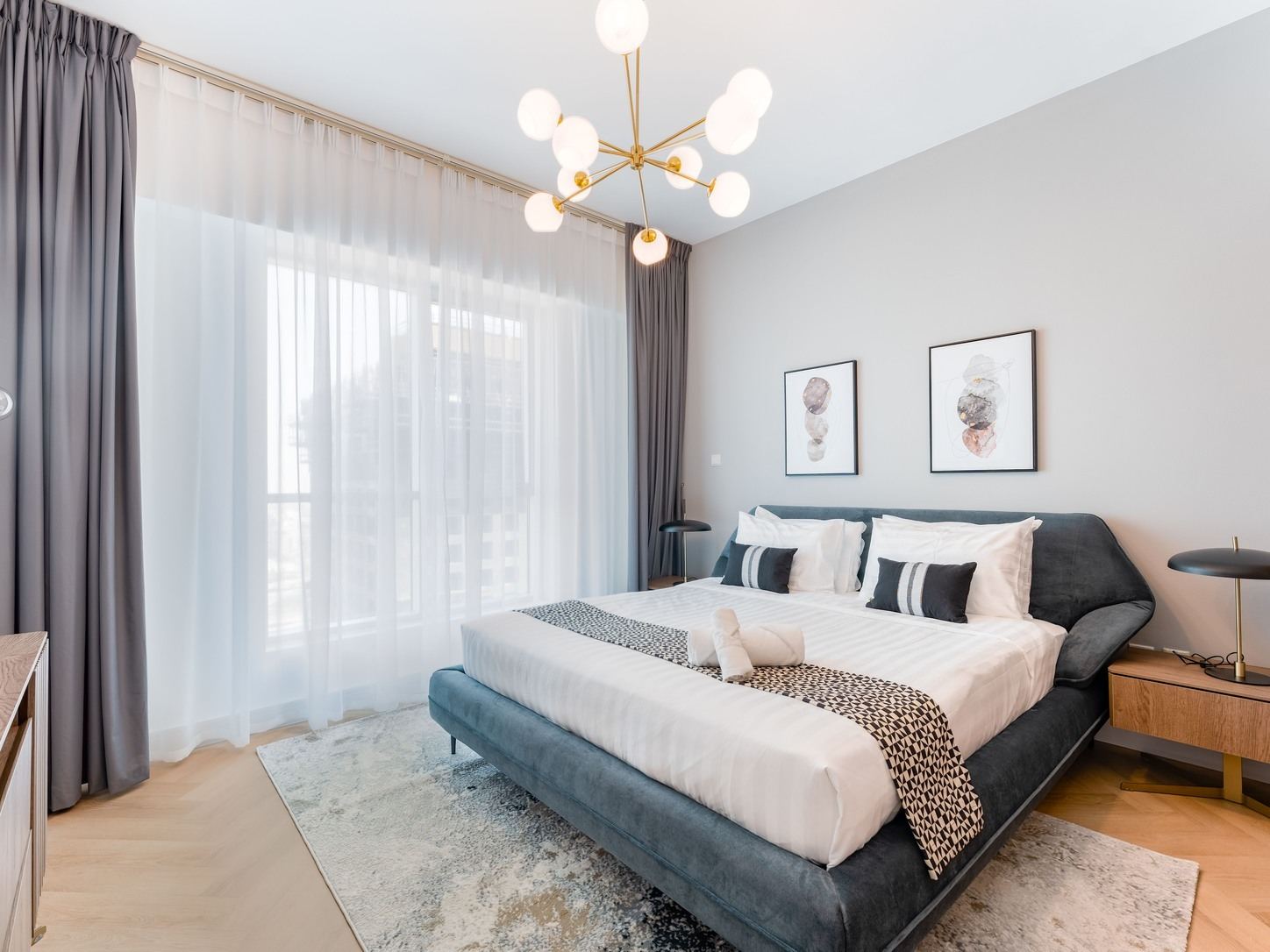 After: the same premium bedroom with linen carefully made and the room reset